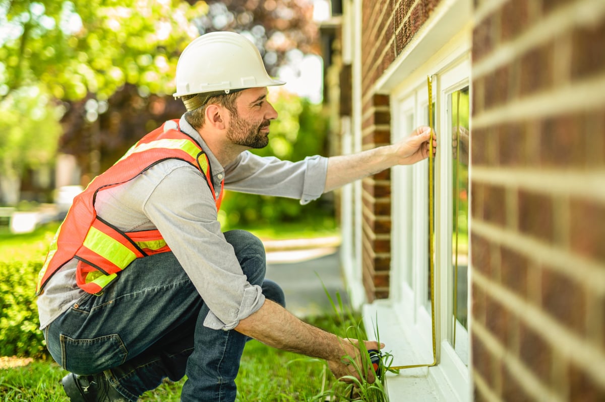 Inspector checking building windows after a renovation